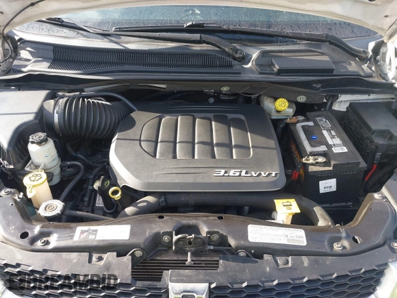 2013 Dodge Grand Caravan Crew with VIN 2C4RDGDG4DR606263, listed as a IAAI auction lot 41898351 with 127,044 mi miles and . Bid and sale history available at DreamBid. Image 10.