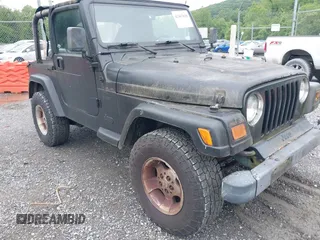 2000 Jeep Wrangler Sport z VIN 1J4FA49S1YP700545, wystawiony jako IAAI lot #42367828 z przebiegiem 214 698 mil mil oraz . Historia ofert i sprzedaży dostępna na DreamBid. Obrazek 1.