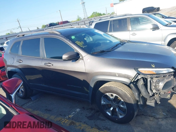 2014 Jeep Cherokee Trailhawk with VIN 1C4PJMBS6EW167517, listed as a IAAI auction lot 41947552 with 233,572 mi miles. Bid and sale history available at carsss.com. Image 14.