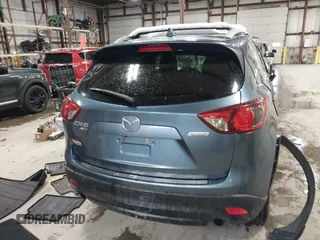 2016 Mazda CX-5 Grand Touring z VIN JM3KE4DY9G0714468, wystawiony jako IAAI lot #41860956 z przebiegiem 114 481 mil mil oraz . Historia ofert i sprzedaży dostępna na DreamBid. Obrazek 16.