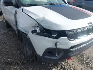 2022 Jeep Compass Trailhawk z VIN 3C4NJDDB7NT226018, wystawiony jako IAAI lot #40929794 z przebiegiem 25 702 mil mil oraz . Historia ofert i sprzedaży dostępna na DreamBid. Obrazek 6.