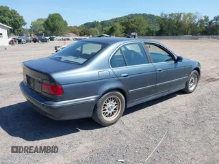 2000 BMW 5 Series 528iA with VIN WBADM6344YGU26491, listed as a IAAI auction lot 40301317 with 157,798 mi miles. Bid and sale history available at carsss.com. Image 4.