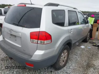 2009 Kia Borrego LX with VIN KNDJJ741395023592, listed as a IAAI auction lot 41554393 with 428,680 mi miles. Bid and sale history available at carsss.com. Image 4.