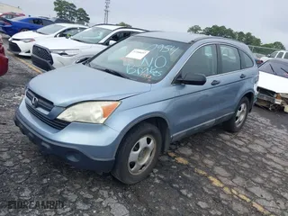 2008 Honda CR-V LX with VIN 3CZRE38348G700954, listed as a IAAI auction lot 37268497 with 140,121 mi miles. Bid and sale history available at carsss.com. Image 2.