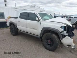 2017 Toyota Tacoma SR5 z VIN 3TMCZ5AN8HM077203, wystawiony jako IAAI lot #41765910 z przebiegiem 170 863 mil mil oraz . Historia ofert i sprzedaży dostępna na DreamBid. Obrazek 1.