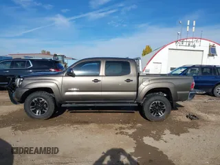 2014 Toyota Tacoma with VIN 3TMLU4EN3EM143882, listed as a IAAI auction lot 40657975 with 125,008 mi miles. Bid and sale history available at carsss.com. Image 14.
