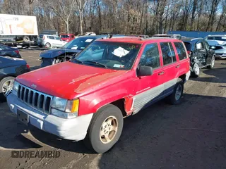 1997 Jeep Grand Cherokee Laredo with VIN 1J4GZ58S0VC550242, listed as a IAAI auction lot 41032114 with 185,307 mi miles. Bid and sale history available at carsss.com. Image 17.