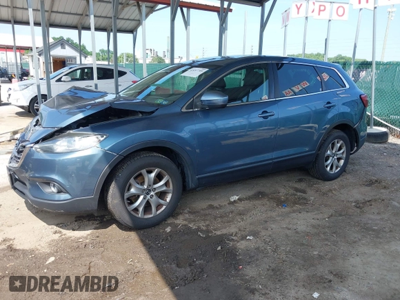 2014 Mazda CX-9 Touring with VIN JM3TB3CV7E0440747, listed as a IAAI auction lot 42457709 with 166,588 mi miles and . Bid and sale history available at DreamBid. Image 2.