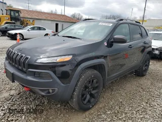 2015 Jeep Cherokee Trailhawk z VIN 1C4PJMBS4FW624536, wystawiony jako Copart lot #51210105 z przebiegiem 148 437 mil mil oraz Szkoda całkowita • Salvage title. Historia ofert i sprzedaży dostępna na DreamBid. Obrazek 1.