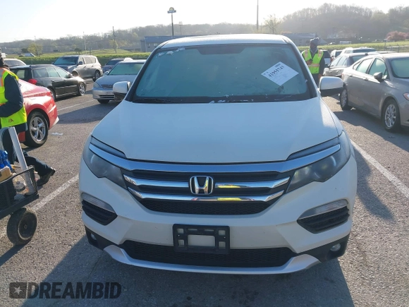 2017 Honda Pilot EX-L with VIN 5FNYF6H54HB015814, listed as a IAAI auction lot 41955743 with 122,389 mi miles and . Bid and sale history available at DreamBid. Image 12.