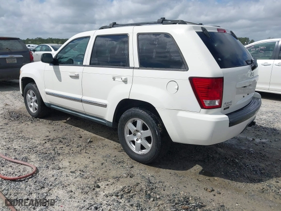 2010 Jeep Grand Cherokee Laredo with VIN 1J4PR4GK0AC151711, listed as a IAAI auction lot 41940295 with 185,684 mi miles. Bid and sale history available at carsss.com. Image 3.