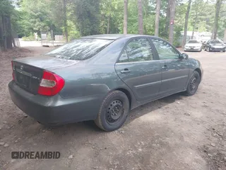 2002 Toyota Camry LE z VIN 4T1BE32K12U619689, wystawiony jako IAAI lot #42222078 z przebiegiem 216 591 mil mil oraz . Historia ofert i sprzedaży dostępna na DreamBid. Obrazek 4.