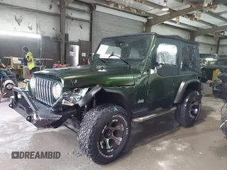 1998 Jeep Wrangler SE with VIN 1J4FY29P2WP733255, listed as a IAAI auction lot 41554602 with 157,316 mi miles. Bid and sale history available at carsss.com. Image 14.