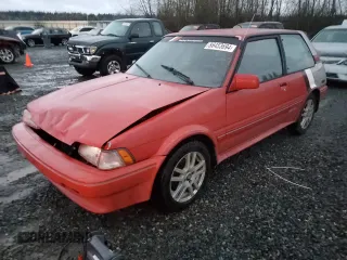 1987 Toyota Corolla with VIN 1NXAE89G0HZ406025, listed as a Copart auction lot 86453694 with 210,704 mi miles and Salvage title. Bid and sale history available at DreamBid. Image 1.