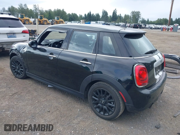 2015 MINI Hardtop 4 Door with VIN WMWXS5C58FT833420, listed as a IAAI auction lot 42560244 with 115,446 mi miles and . Bid and sale history available at DreamBid. Image 3.
