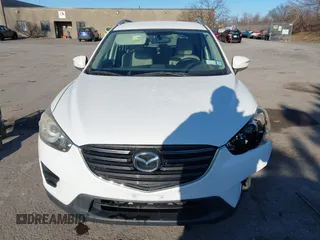 2016 Mazda CX-5 Sport with VIN JM3KE4BY8G0605504, listed as a IAAI auction lot 41866173 with 91,797 mi miles. Bid and sale history available at carsss.com. Image 13.