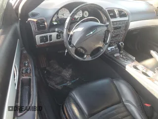 2003 Ford Thunderbird Deluxe z VIN 1FAHP60A63Y107026, wystawiony jako Copart lot #70650964 z przebiegiem 36 115 mil mil oraz Szkoda całkowita • Salvage title. Historia ofert i sprzedaży dostępna na DreamBid. Obrazek 8.
