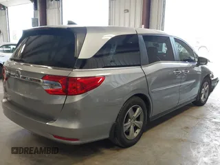 2018 Honda Odyssey EX-L z VIN 5FNRL6H70JB059653, wystawiony jako IAAI lot #42324330 z przebiegiem 115 623 mil mil oraz . Historia ofert i sprzedaży dostępna na DreamBid. Obrazek 4.