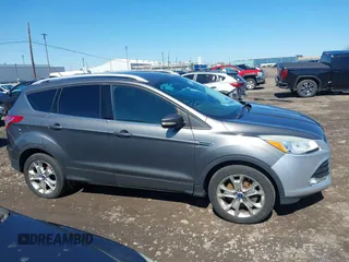 2014 Ford Escape Titanium with VIN 1FMCU9JX1EUB94776, listed as a IAAI auction lot 42063678 with 138,036 mi miles. Bid and sale history available at carsss.com. Image 13.