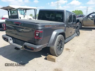 2021 Jeep Gladiator High Altitude z VIN 1C6HJTFG1ML597581, wystawiony jako IAAI lot #42191690 z przebiegiem 47 740 mil mil oraz . Historia ofert i sprzedaży dostępna na DreamBid. Obrazek 4.
