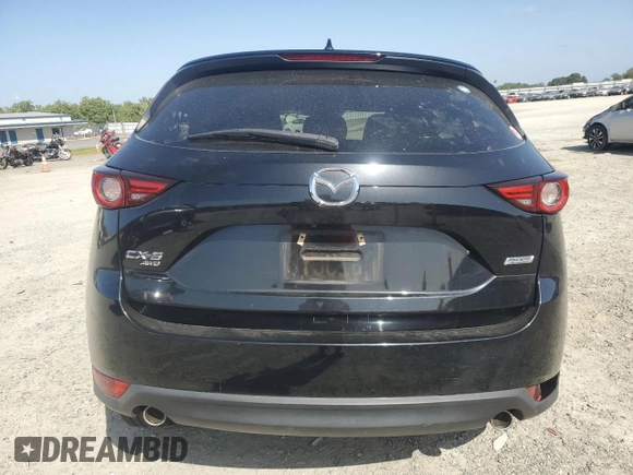 2018 Mazda CX-5 Grand Touring z VIN JM3KFBDM0J0399985, wystawiony jako Copart lot #54097665 z przebiegiem 45 344 mil mil oraz Szkoda całkowita • Salvage title. Historia ofert i sprzedaży dostępna na DreamBid. Obrazek 6.