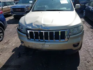 2011 Jeep Grand Cherokee Laredo with VIN 1J4RR4GG8BC590094, listed as a IAAI auction lot 41990149 with 178,510 mi miles. Bid and sale history available at carsss.com. Image 6.
