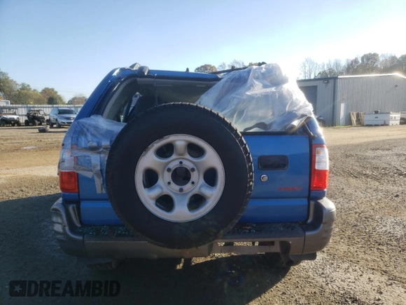 2001 Isuzu Rodeo S with VIN 4S2DM58WX14301336, listed as a Copart auction lot 77770164 with Not provided miles and Salvage title. Bid and sale history available at DreamBid. Image 6.