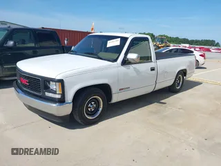 1994 GMC Sierra 1500 z VIN 1GTFC24KXRE522028, wystawiony jako IAAI lot #42463380 z przebiegiem 153 411 mil mil oraz . Historia ofert i sprzedaży dostępna na DreamBid. Obrazek 13.