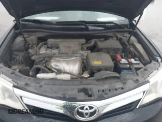 2014 Toyota Camry L with VIN 4T1BF1FK0EU823710, listed as a IAAI auction lot 42153523 with 105,468 mi miles and . Bid and sale history available at DreamBid. Image 10.