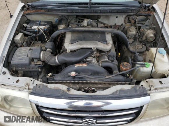 2001 Suzuki XL7 Touring z VIN JS3TY92V714106251, wystawiony jako Copart lot #79281204 z przebiegiem 334 901 mil mil oraz Szkoda całkowita • Salvage title. Historia ofert i sprzedaży dostępna na DreamBid. Obrazek 11.