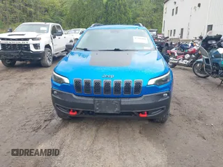 2021 Jeep Cherokee Trailhawk with VIN 1C4PJMBXXMD173102, listed as a IAAI auction lot 42205402 with 57,321 mi miles and . Bid and sale history available at DreamBid. Image 13.