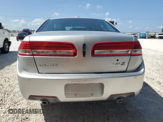 2012 Lincoln MKZ z VIN 3LNHL2GC4CR800578, wystawiony jako Copart lot #58409215 z przebiegiem 49 423 mil mil oraz Szkody całkowita. Historia ofert i sprzedaży dostępna na DreamBid. Obrazek 6.