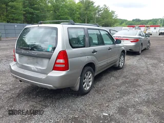 2005 Subaru Forester XS with VIN JF1SG65605H745494, listed as a IAAI auction lot 42382364 with 256,505 mi miles and . Bid and sale history available at DreamBid. Image 4.