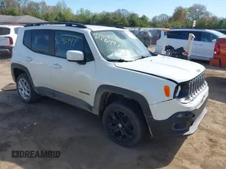 2017 Jeep Renegade Latitude z VIN ZACCJBBB6HPE84704, wystawiony jako IAAI lot #42146997 z przebiegiem 99 412 mil mil oraz . Historia ofert i sprzedaży dostępna na DreamBid. Obrazek 1.