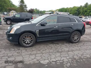 2013 Cadillac SRX Performance Collection z VIN 3GYFNHE39DS642111, wystawiony jako IAAI lot #42470291 z przebiegiem 176 239 mil mil oraz . Historia ofert i sprzedaży dostępna na DreamBid. Obrazek 14.