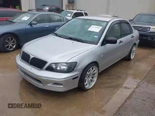 2003 Mitsubishi Lancer ES with VIN JA3AJ26E43U038813, listed as a IAAI auction lot 41778956 with 150,764 mi miles. Bid and sale history available at carsss.com. Image 2.