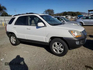 2005 Kia Sportage LX with VIN KNDJF723857134398, listed as a Copart auction lot 87893375 with 186,405 mi miles and Salvage Title. Bid and sale history available at carsss.com. Image 4.