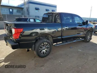 2017 Nissan Titan SL z VIN 1N6BA1F20HN522403, wystawiony jako Copart lot #87477114 z przebiegiem 98 084 mil mil oraz Szkoda całkowita • Salvage title. Historia ofert i sprzedaży dostępna na DreamBid. Obrazek 3.