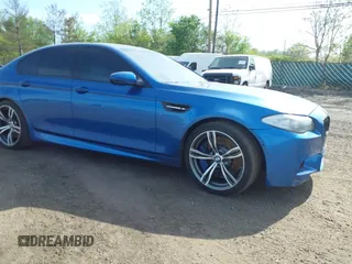 2013 BMW M5 with VIN WBSFV9C56DC774032, listed as a IAAI auction lot 42124754 with 55,409 mi miles. Bid and sale history available at carsss.com. Image 6.