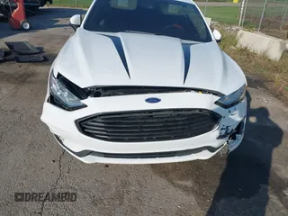 2020 Ford Fusion SE z VIN 3FA6P0T93LR247572, wystawiony jako IAAI lot #40481880 z przebiegiem 59 141 mil mil oraz . Historia ofert i sprzedaży dostępna na DreamBid. Obrazek 6.