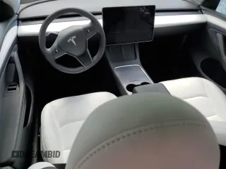 2024 Tesla Model Y Long Range with VIN 7SAYGDEE4RA285620, listed as a Copart auction lot 57883015 with 18,841 mi miles and Salvage title. Bid and sale history available at DreamBid. Image 8.
