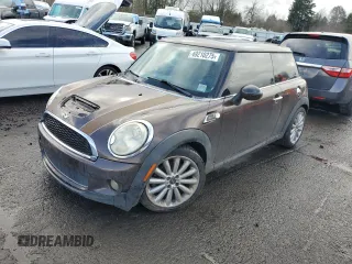 2010 MINI Hardtop S with VIN WMWMF7C53ATZ71328, listed as a Copart auction lot 49210275 with 114,653 mi miles and Salvage title. Bid and sale history available at DreamBid. Image 1.