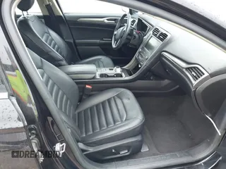 2019 Ford Fusion Hybrid SEL with VIN 3FA6P0MU1KR202860, listed as a IAAI auction lot 41983299 with 133,671 mi miles. Bid and sale history available at carsss.com. Image 5.