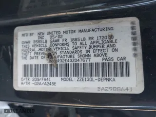 2003 Toyota Corolla CE with VIN 1NXBR32E43Z047677, listed as a IAAI auction lot 41427393 with 299,999 mi miles. Bid and sale history available at carsss.com. Image 9.