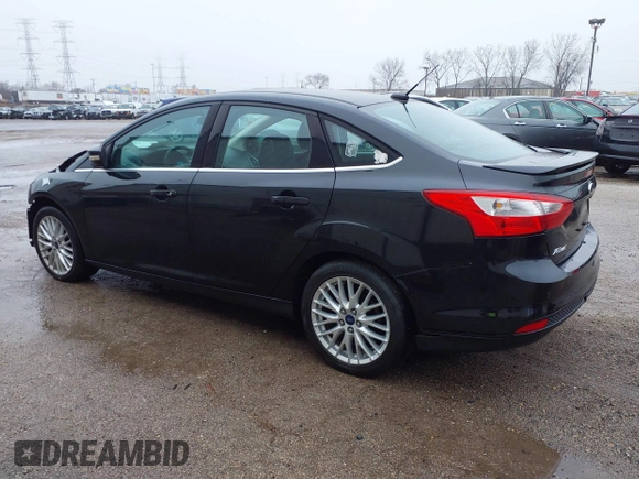 2014 Ford Focus Titanium with VIN 1FADP3J25EL310199, listed as a IAAI auction lot 40682901 with 84,885 mi miles and . Bid and sale history available at DreamBid. Image 3.