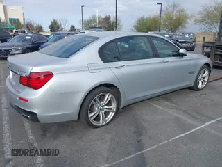 2015 BMW 7 Series 750Li with VIN WBAYE8C5XFD782039, listed as a IAAI auction lot 41505626 with 74,716 mi miles. Bid and sale history available at carsss.com. Image 4.