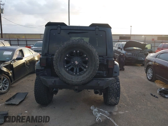 2013 Jeep Wrangler Unlimited Rubicon with VIN 1C4BJWFG2DL531203, listed as a IAAI auction lot 40729064 with 84,296 mi miles. Bid and sale history available at carsss.com. Image 16.