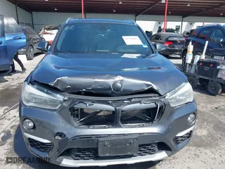 2017 BMW X1 xDrive28i with VIN WBXHT3Z33H4A65198, listed as a IAAI auction lot 41798503 with 88,951 mi miles. Bid and sale history available at carsss.com. Image 12.
