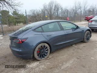 2023 Tesla Model 3 Performance with VIN 5YJ3E1EC9PF407365, listed as a IAAI auction lot 41956915 with 31,087 mi miles. Bid and sale history available at carsss.com. Image 4.