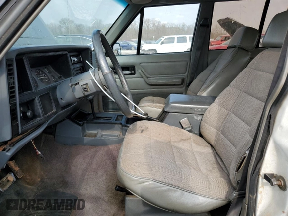 1994 Jeep Cherokee Sport with VIN 1J4FT68S0RL234669, listed as a Copart auction lot 44044555 with 282,179 mi miles and Salvage title. Bid and sale history available at DreamBid. Image 7.